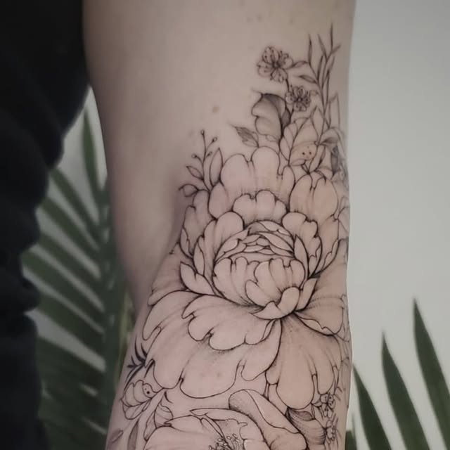Fine-line body tattoo